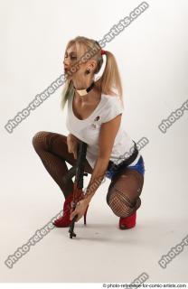 Nikol Squatting Pose With Gun